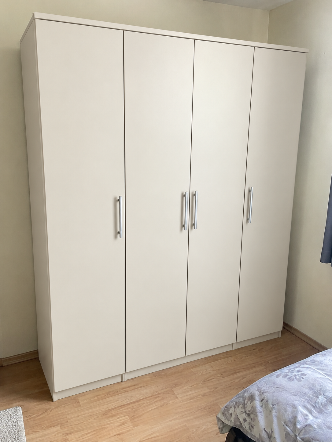 Illustrative same large wardrobe after wrapping, warm white finish