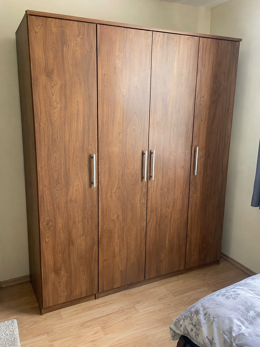 Illustrative large wardrobe before wrapping, brown wood-effect finish